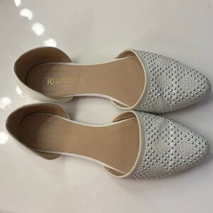 Restricted white and silver pointy flats